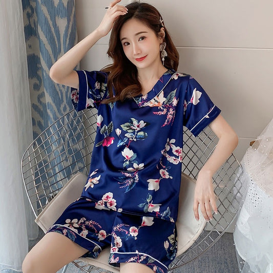 As seen on Xiaohongshu: In-stock summer two-piece pajama set for women—faux silk V-neck casual short-sleeve top and bottoms, available in plus sizes.